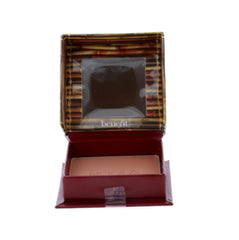 Benefit Hoola compact held in hand showing scale and travel-friendly size