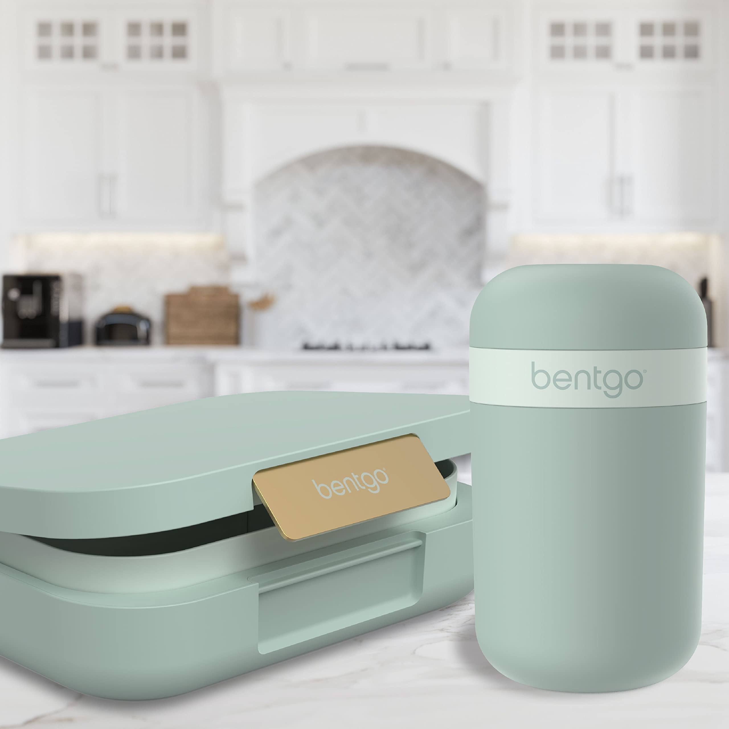 Bentgo snack cup next to hand for scale showing compact capacity