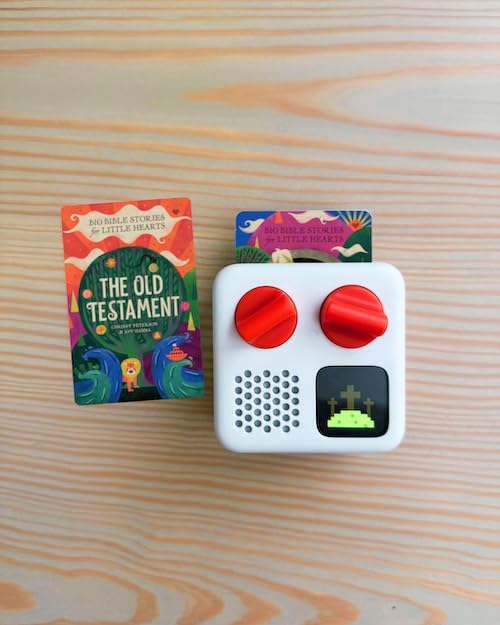 Big Bible Stories card being inserted into a Yoto Player, enables easy screen-free playback