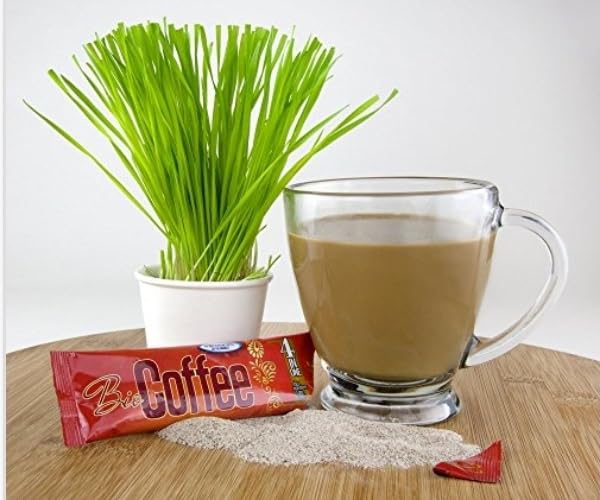Bio Coffee powder on spoon close-up highlighting wheatgrass texture and natural nutrient benefit