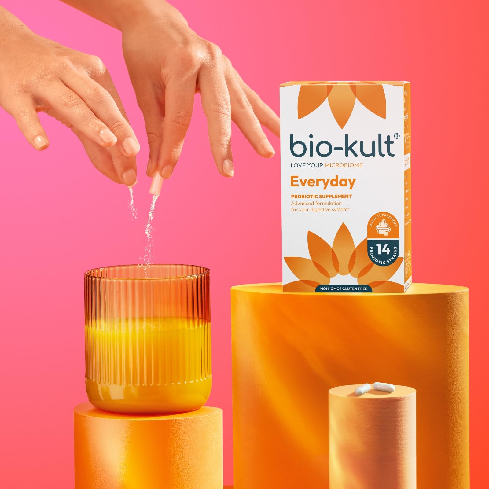 Bio-Kult capsule beside a coin showing size and portability for daily use