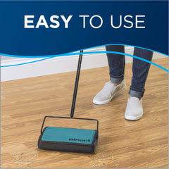 Bissell sweeper bottom bins open to empty debris cleanly, demonstrating easy disposal