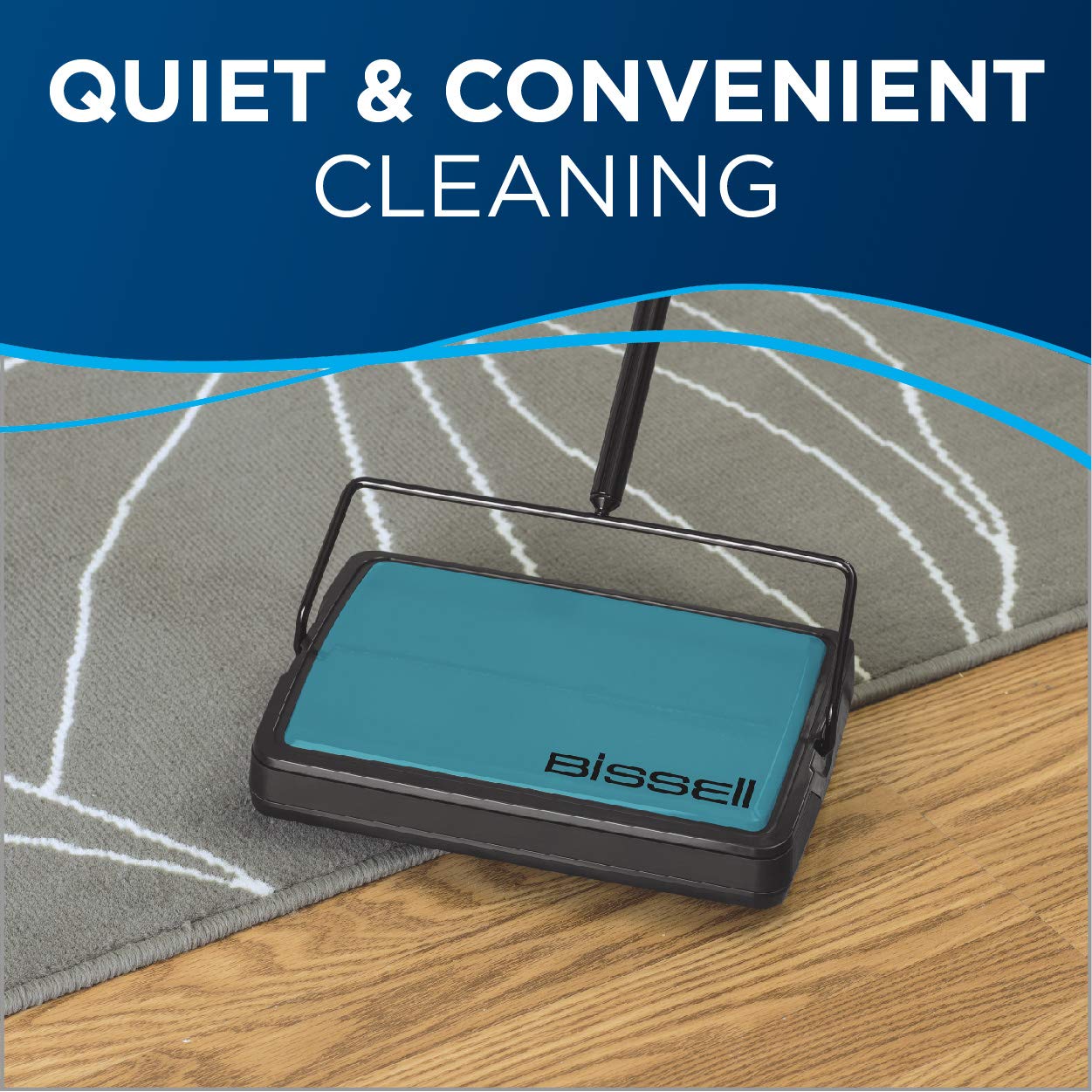 Hand holding Bissell Easy Sweep Compact to show lightweight design and easy maneuvering