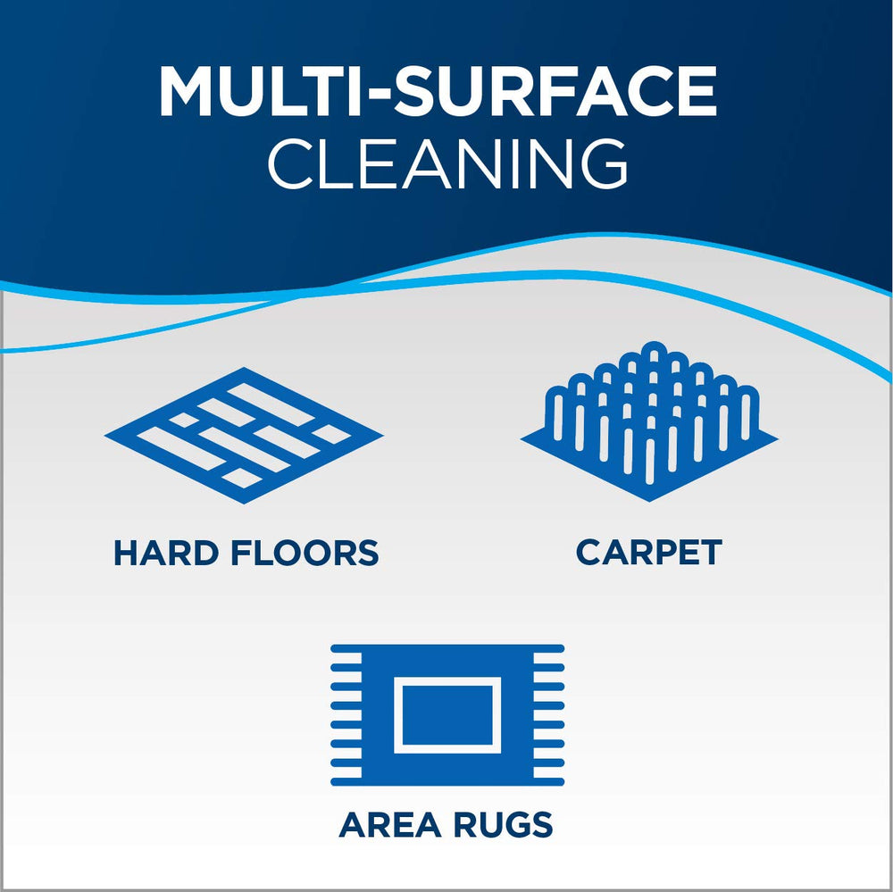 Bissell compact sweeper cleaning kitchen floor in lifestyle scene for fast daily touch-ups