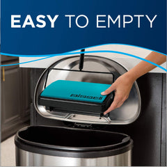 Bissell sweeper sliding under sofa to reach low spaces, illustrating reach and convenience