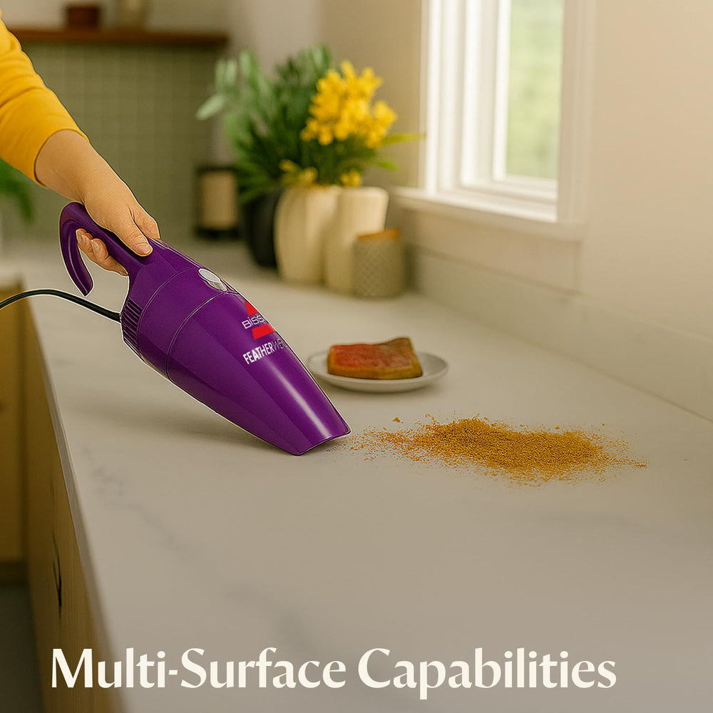 Bissell FeatherWeight floor nozzle on hardwood illustrating efficient surface debris removal