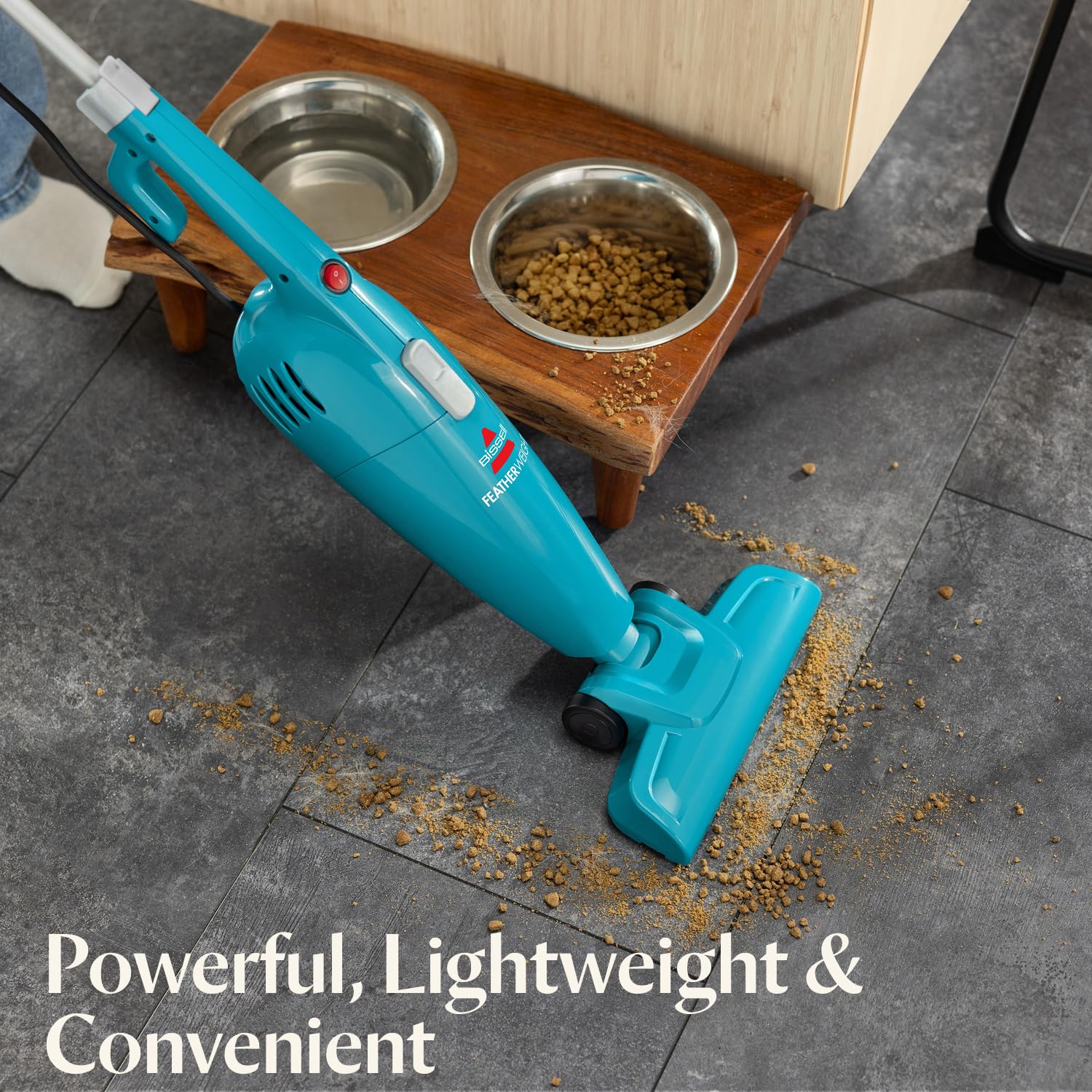 Bissell Featherweight in handheld mode demonstrating quick conversion for spot cleaning