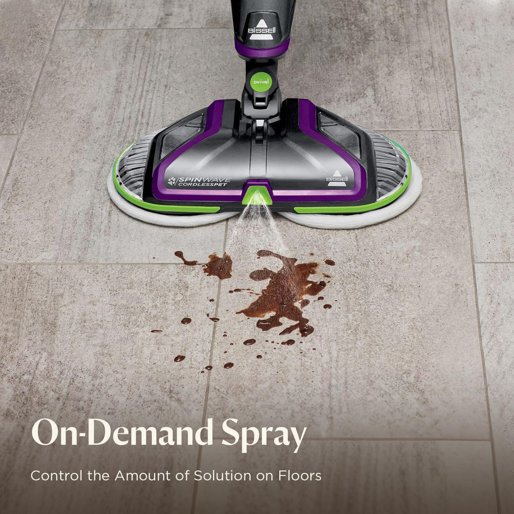 BISSELL in use on sealed hardwood removing a pet mess for restored floor shine