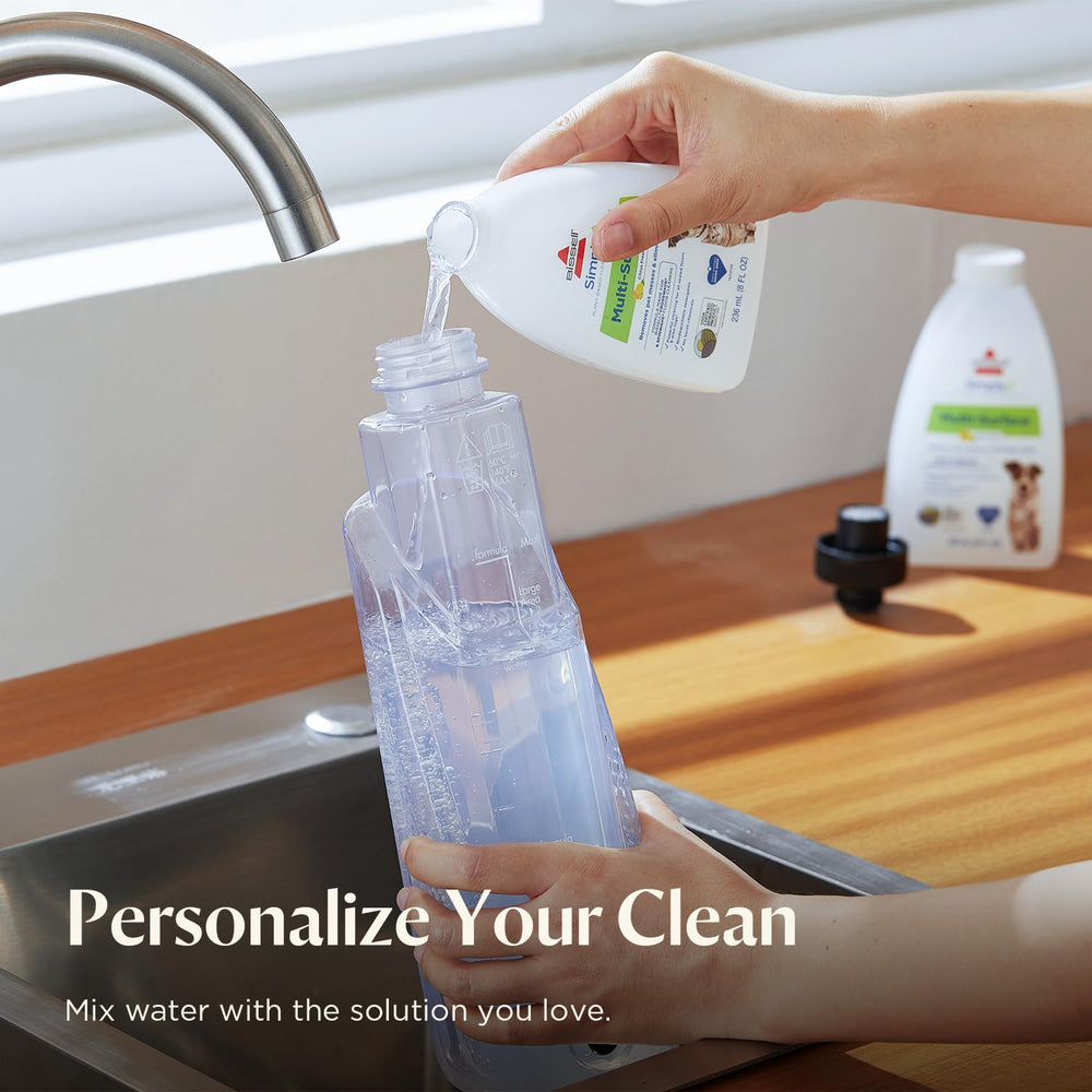BISSELL included accessories laid out: reusable pads and trial cleaning solutions