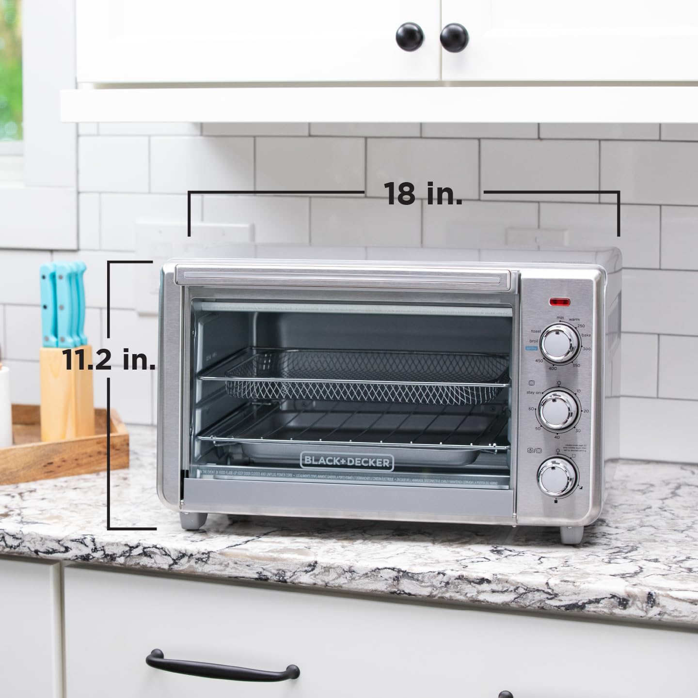 BLACK+DECKER removable crumb tray being removed for fast, mess-free cleanup