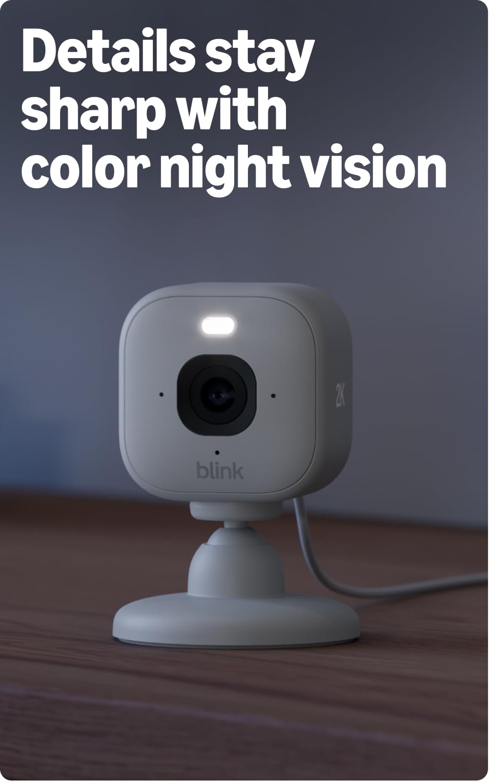Blink Mini 2K+ mounted on a living room wall demonstrating discreet coverage and tidy installation