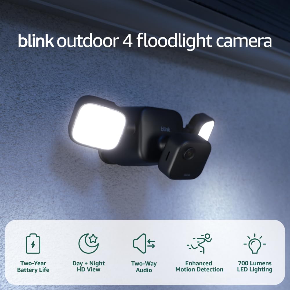 Blink Outdoor 4 mounted at night with 700 lumens illuminating driveway