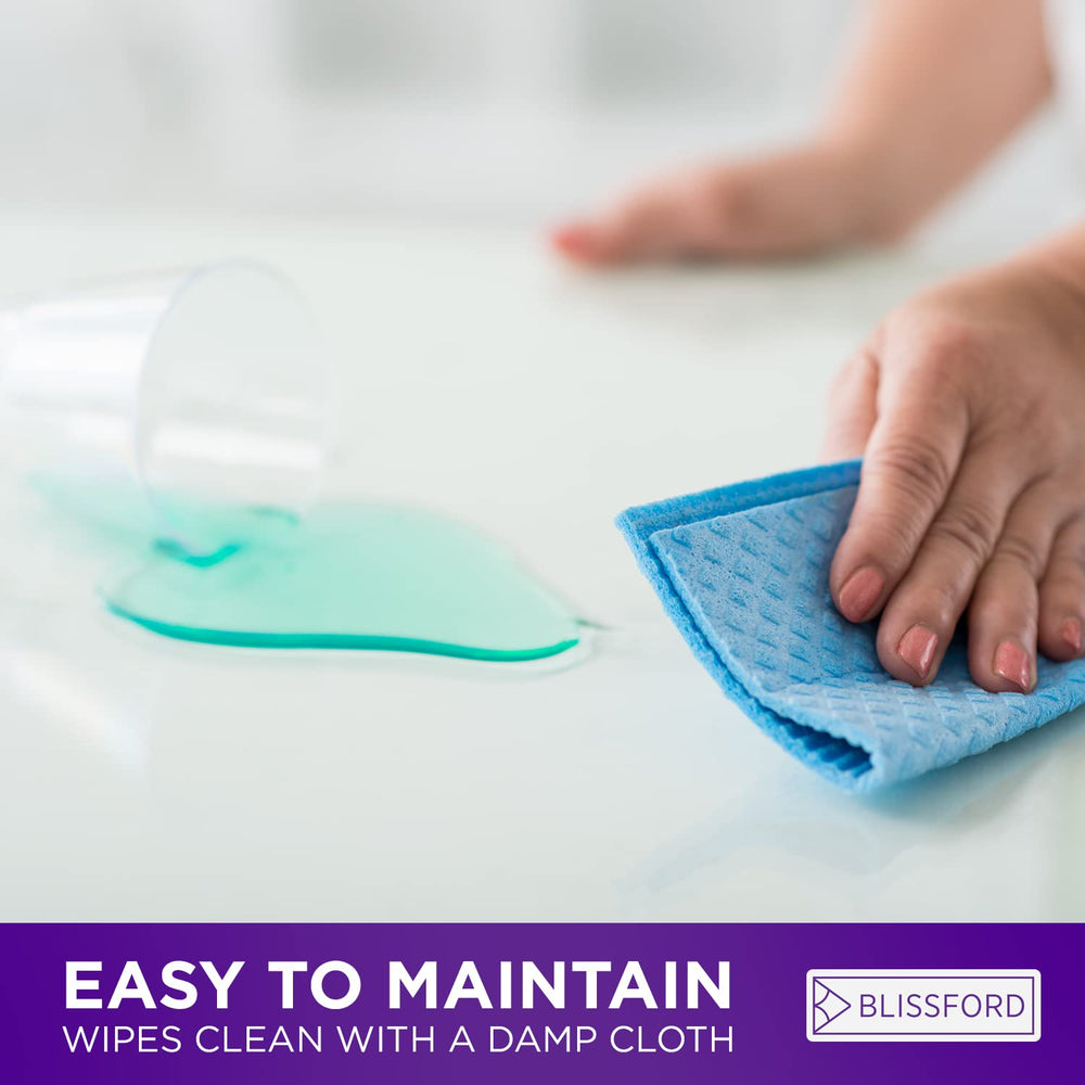 BLISSFORD wiping up a liquid spill to show quick-clean, waterproof convenience