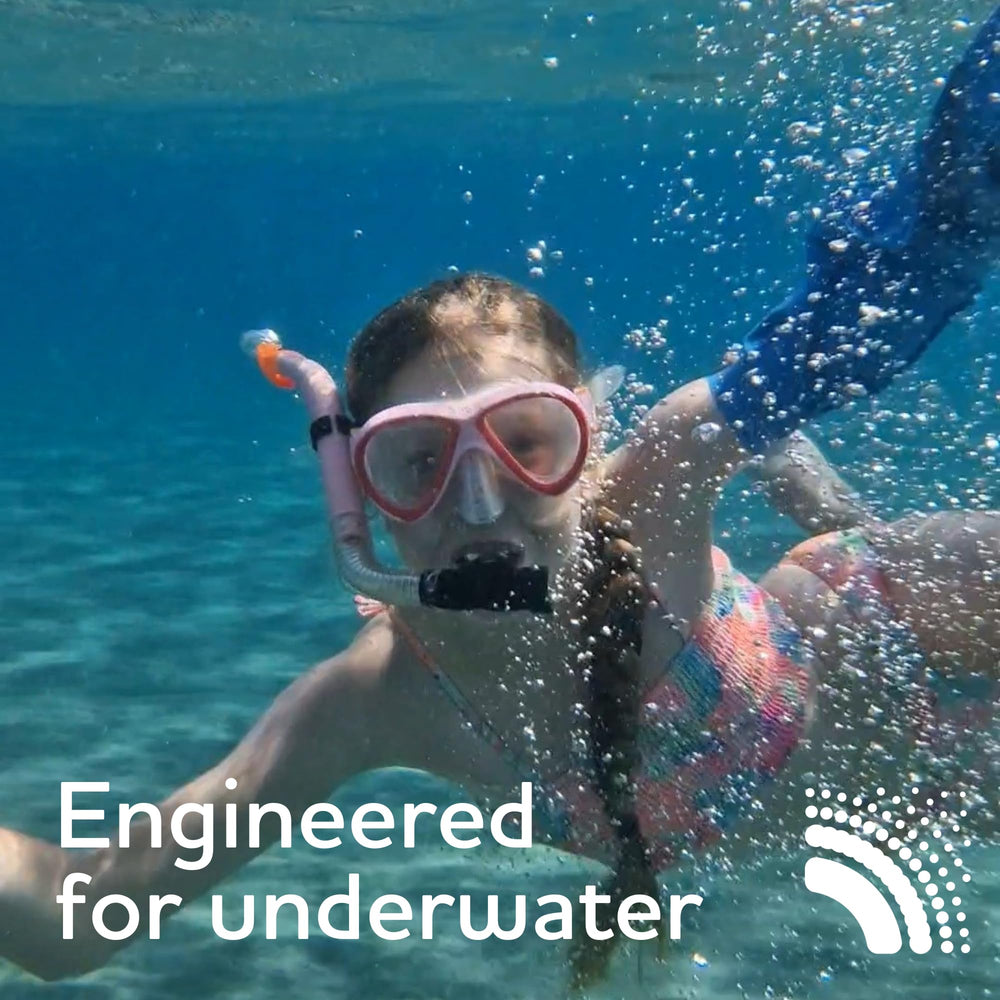 BLOCCS child wearing arm sleeve in pool enabling safe water play
