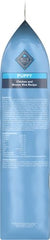 Blue Buffalo ingredients spread with chicken, rice, and vegetables illustrating wholesome recipe