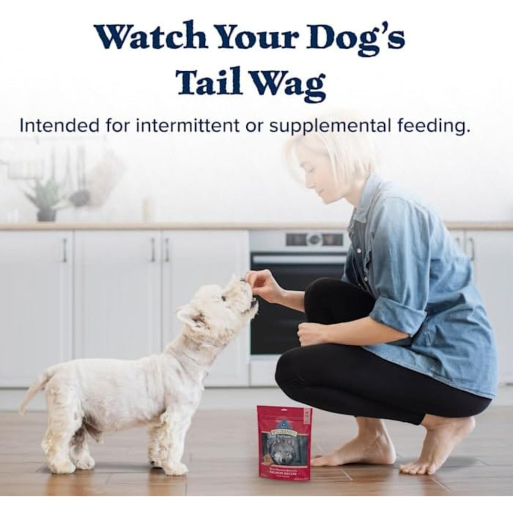 Blue Buffalo dog enjoying treat outdoors illustrating excitement and reward