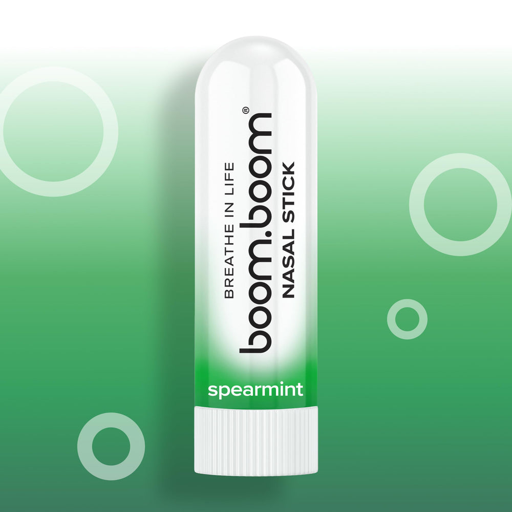 Person using BoomBoom inhaler on a commute to boost alertness and focus