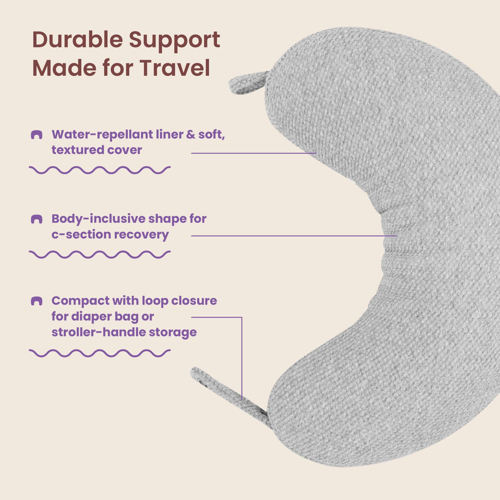 Boppy Anywhere clipped to stroller demonstrating hands-free carrying convenience