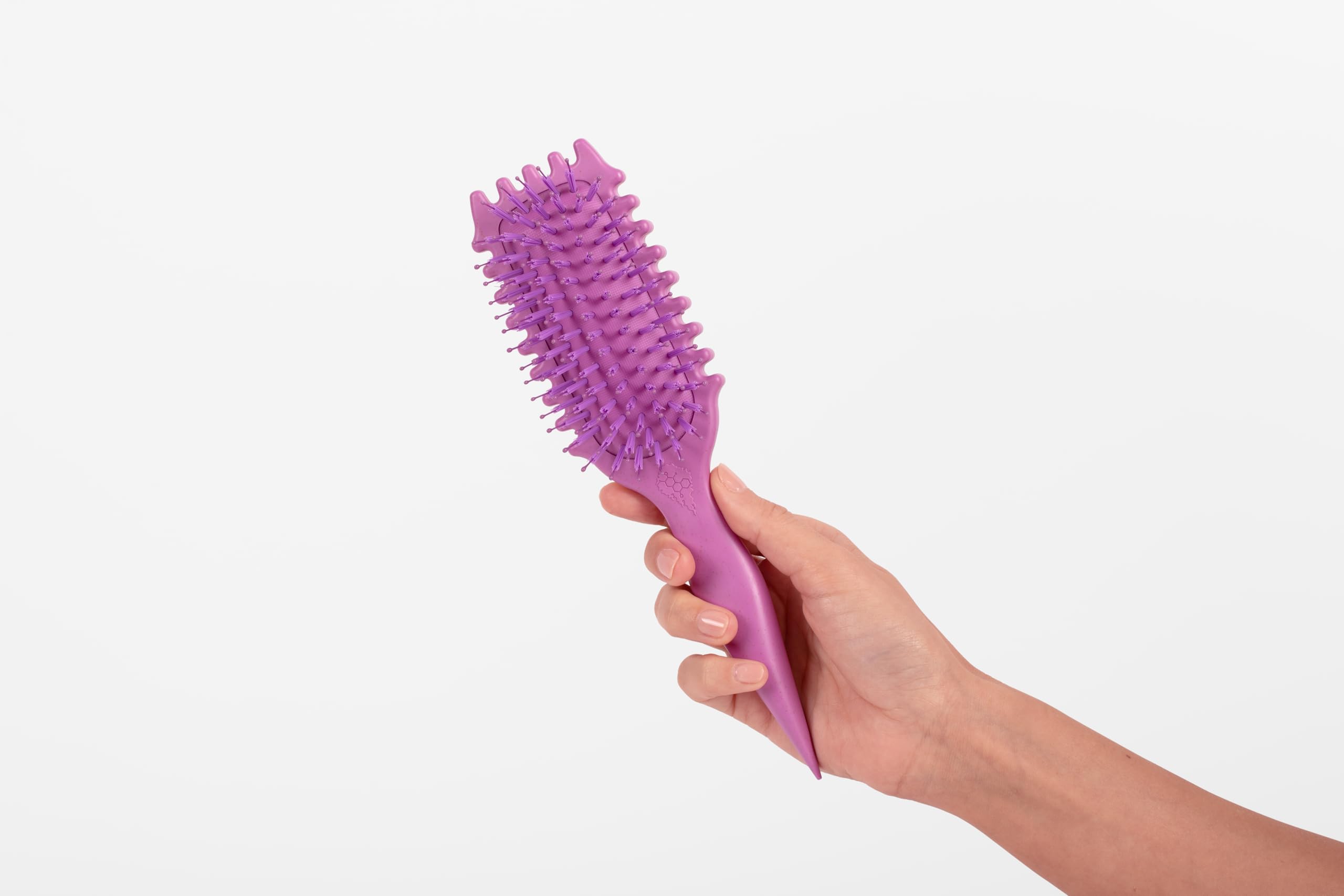 Bounce Curl brush on a vanity in a bathroom lifestyle shot showing everyday readiness