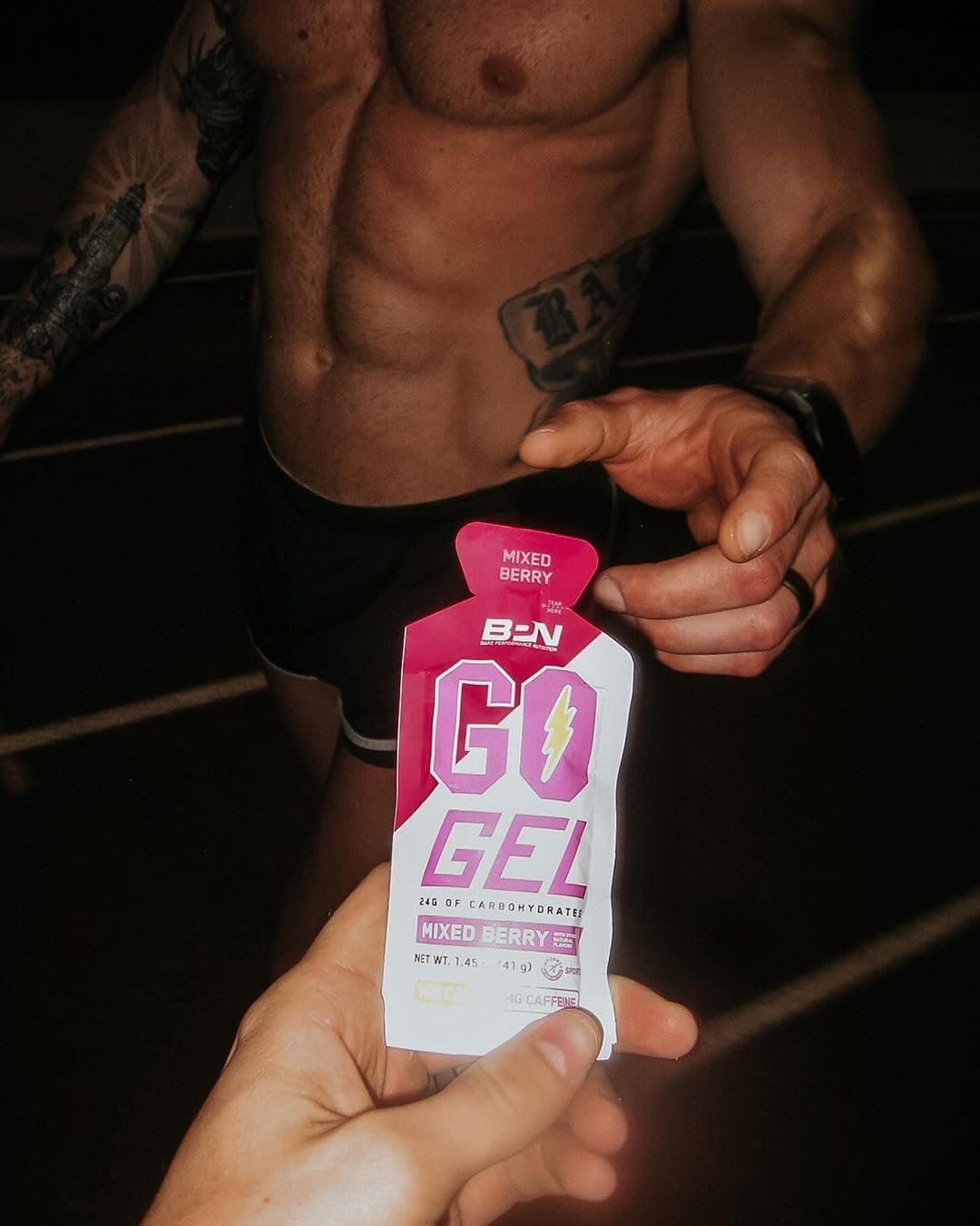BARE PERFORMANCE NUTRITION sachet in hand showing single-serve portion control