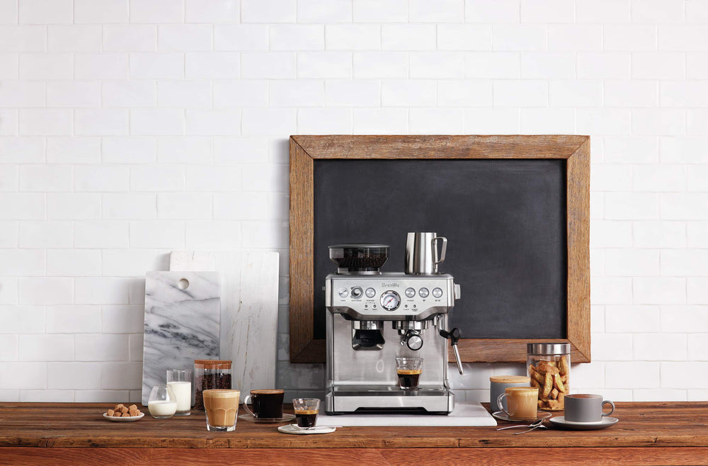 Breville next to a coffee cup showing scale and counter footprint benefit