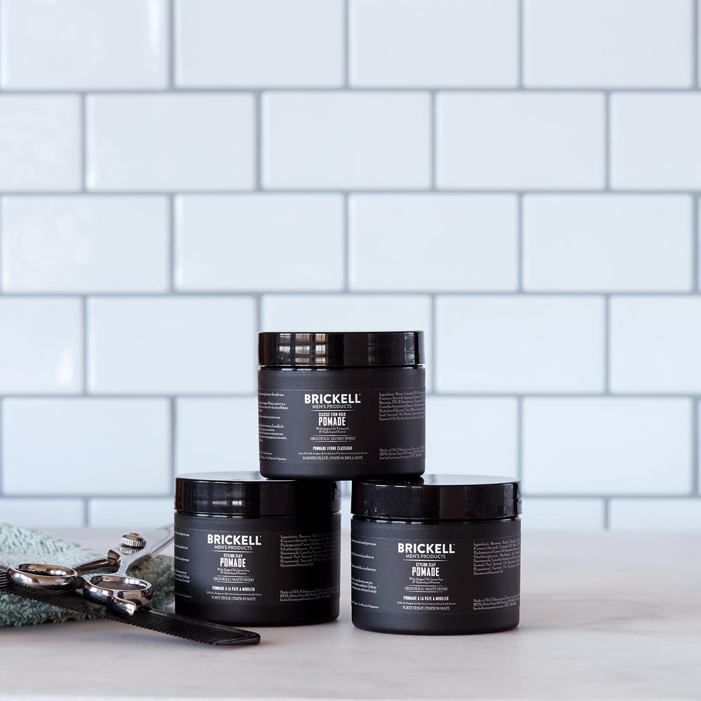 Brickell pomade open jar with visible clay ready to apply benefit