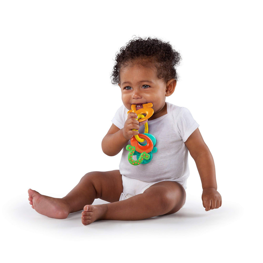 Bright Starts Oball shaker with visible beads providing auditory stimulation benefit
