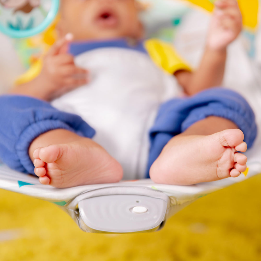 Bright Starts close-up of 3-point harness buckle for secure, adjustable infant restraint