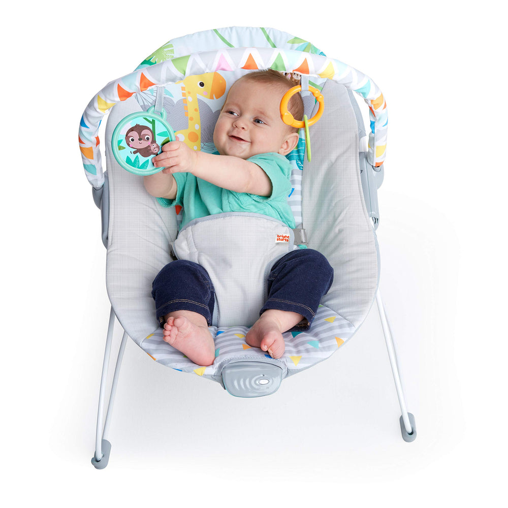 Bright Starts bouncer next to a standard chair to show size and scale for small spaces