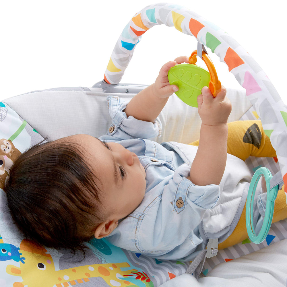 Bright Starts washable insert folded to show removable, machine-washable fabric for easy cleaning