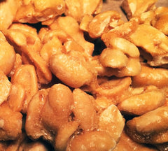 Brittle Brothers open 16 oz box revealing abundant nutty brittle pieces for sharing