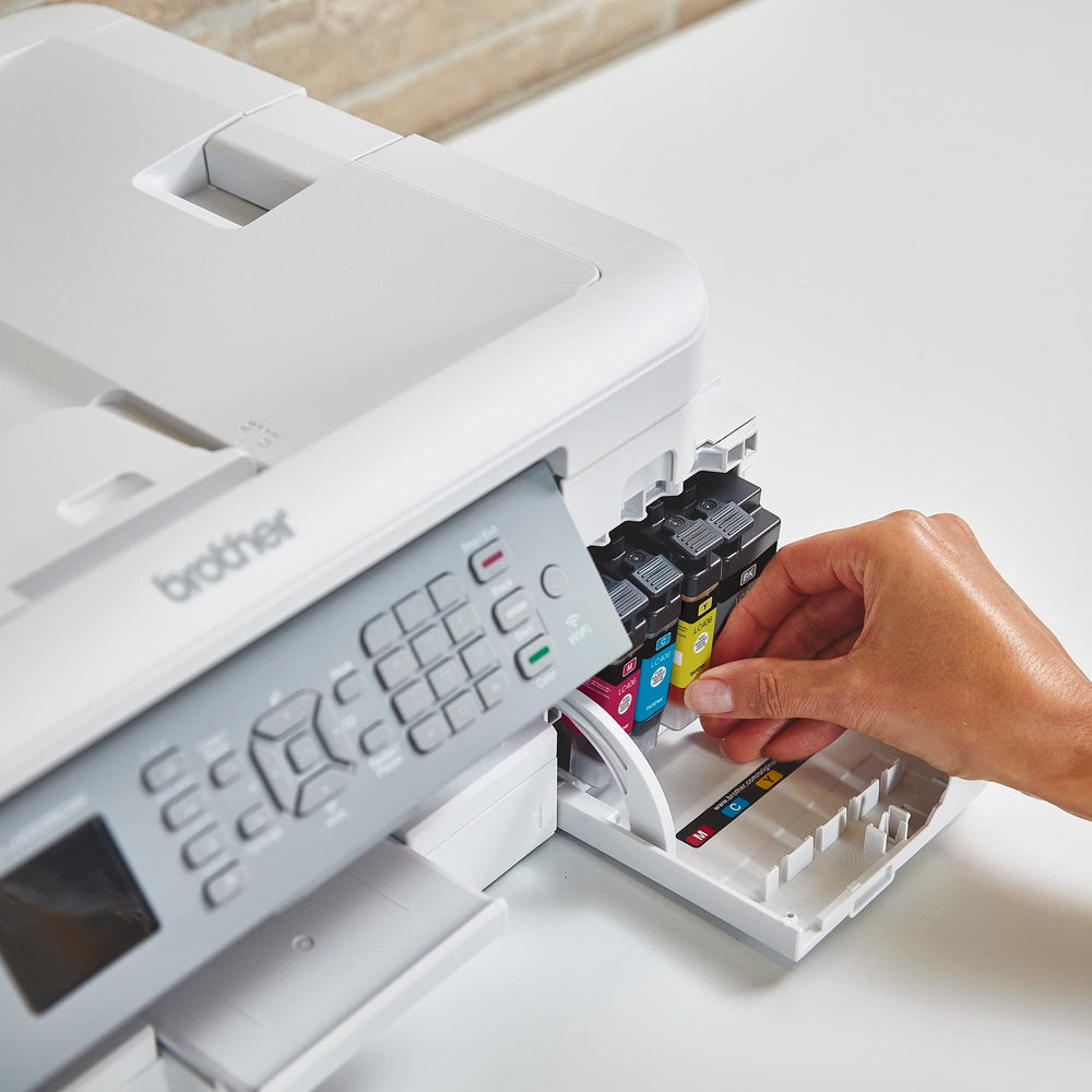 LC406BK cartridge beside a ruler showing Brother size and easy handling