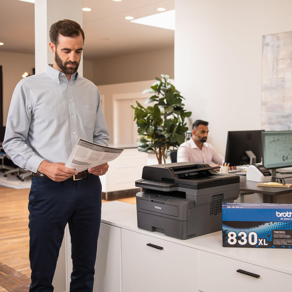 Brother MFC-L2820DW in small office setting illustrating reliable daily monochrome printing