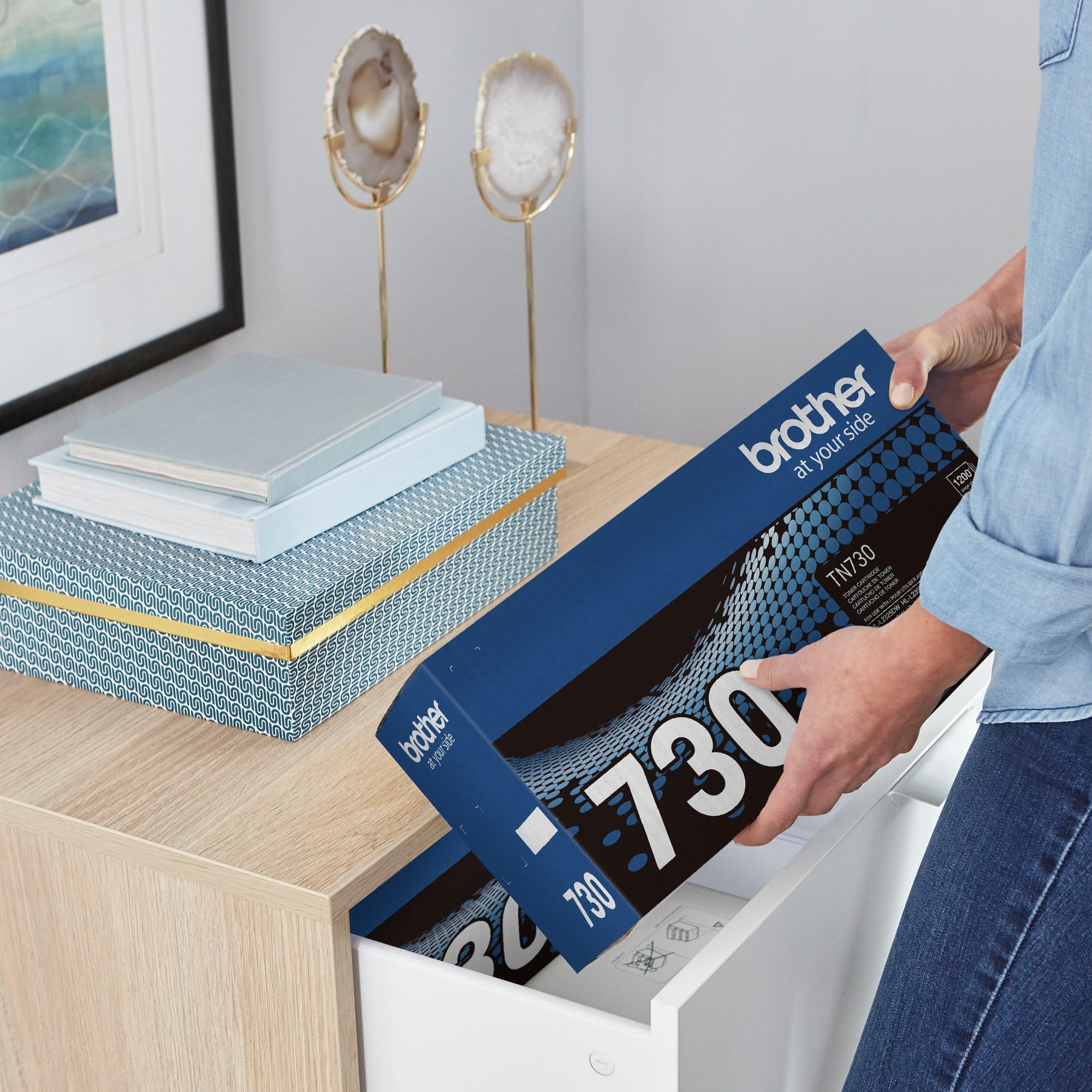 Brother TN-730 next to a letter sheet for scale — clear size and capacity reference