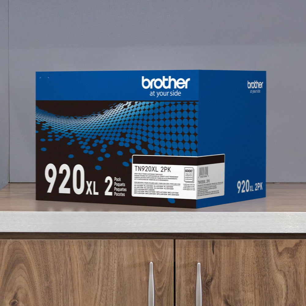 Brother TN920XL next to ruler to show cartridge scale and fitment