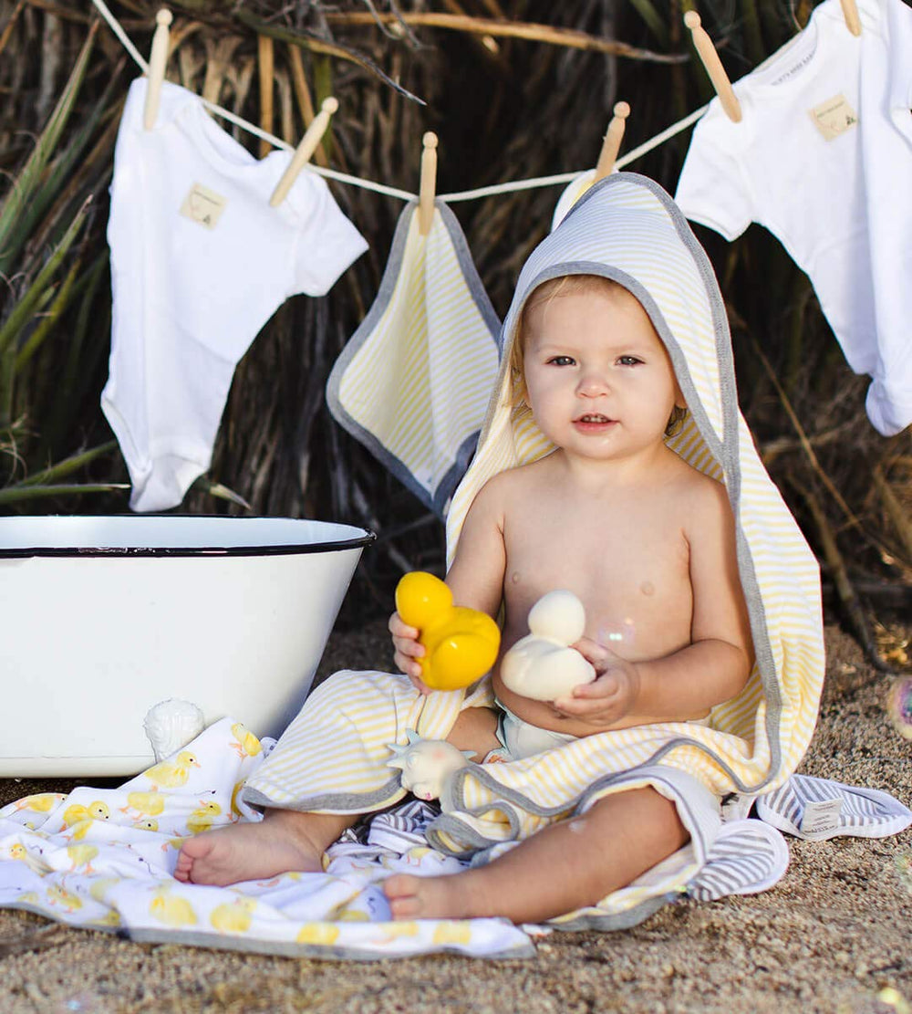 Burt's Bees Baby towel wrapped around infant after bath illustrating warm absorbency benefit