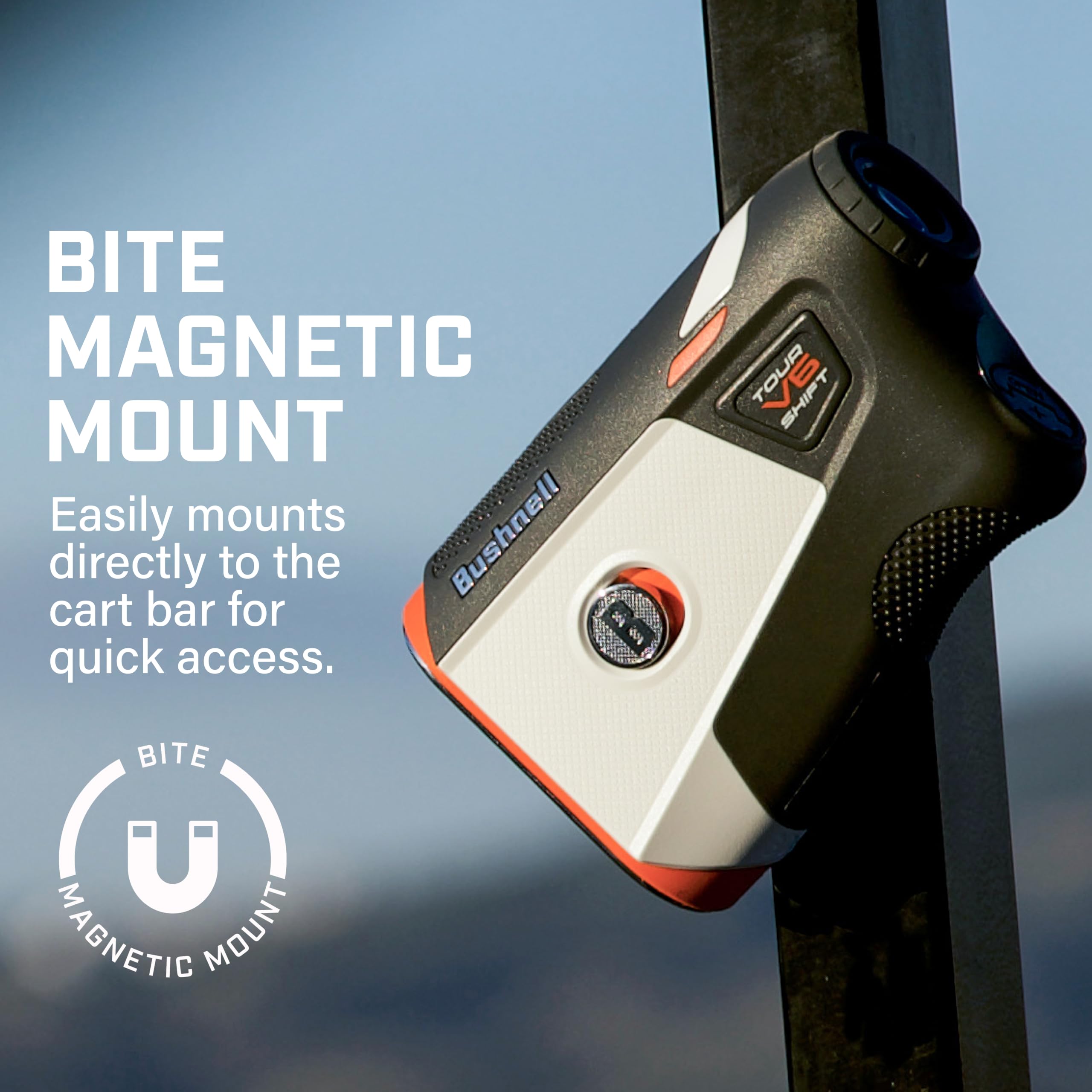 Bushnell Tour V6 Shift laid out with coin, cloth, guide, battery for readiness
