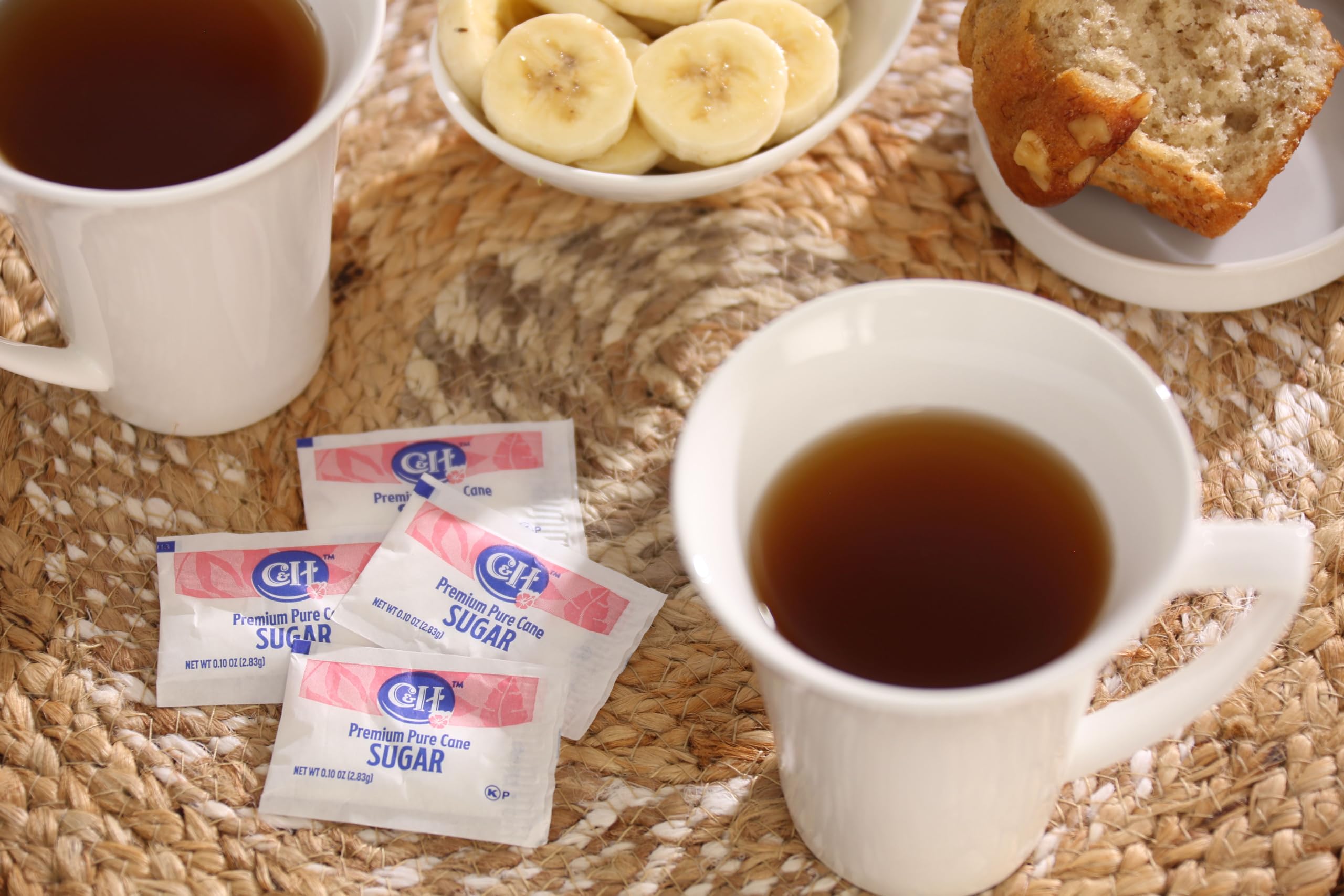 C&H packets next to coffee cup showing portion size and serving clarity