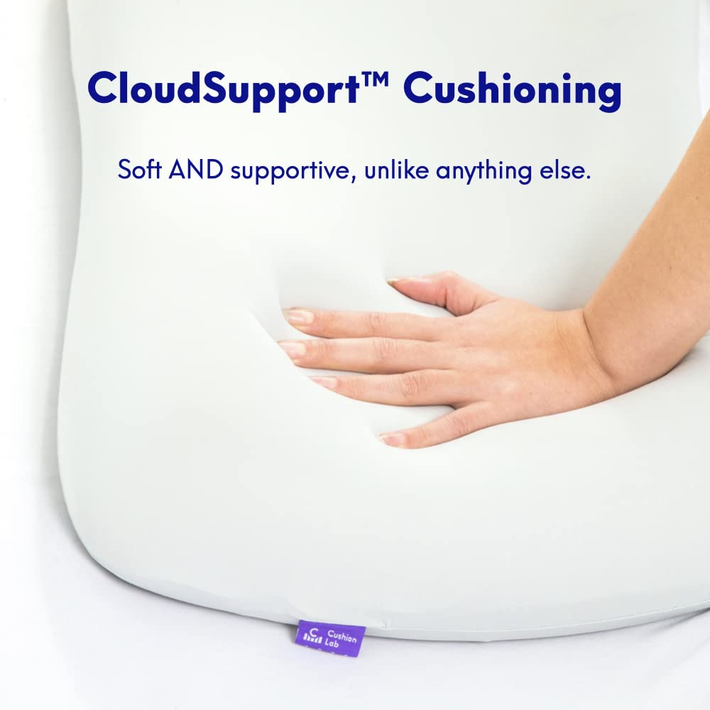 C CUSHION LAB pillow next to hand showing size and scale for accurate fit expectations