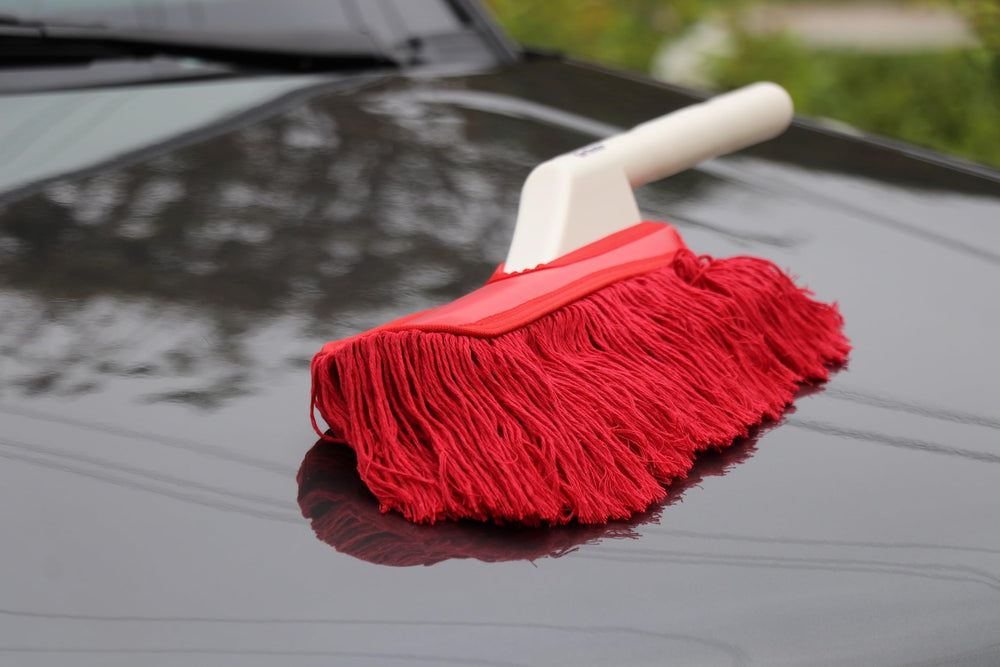 California Car Duster cleaning dashboard and vents for detailed interior care benefit