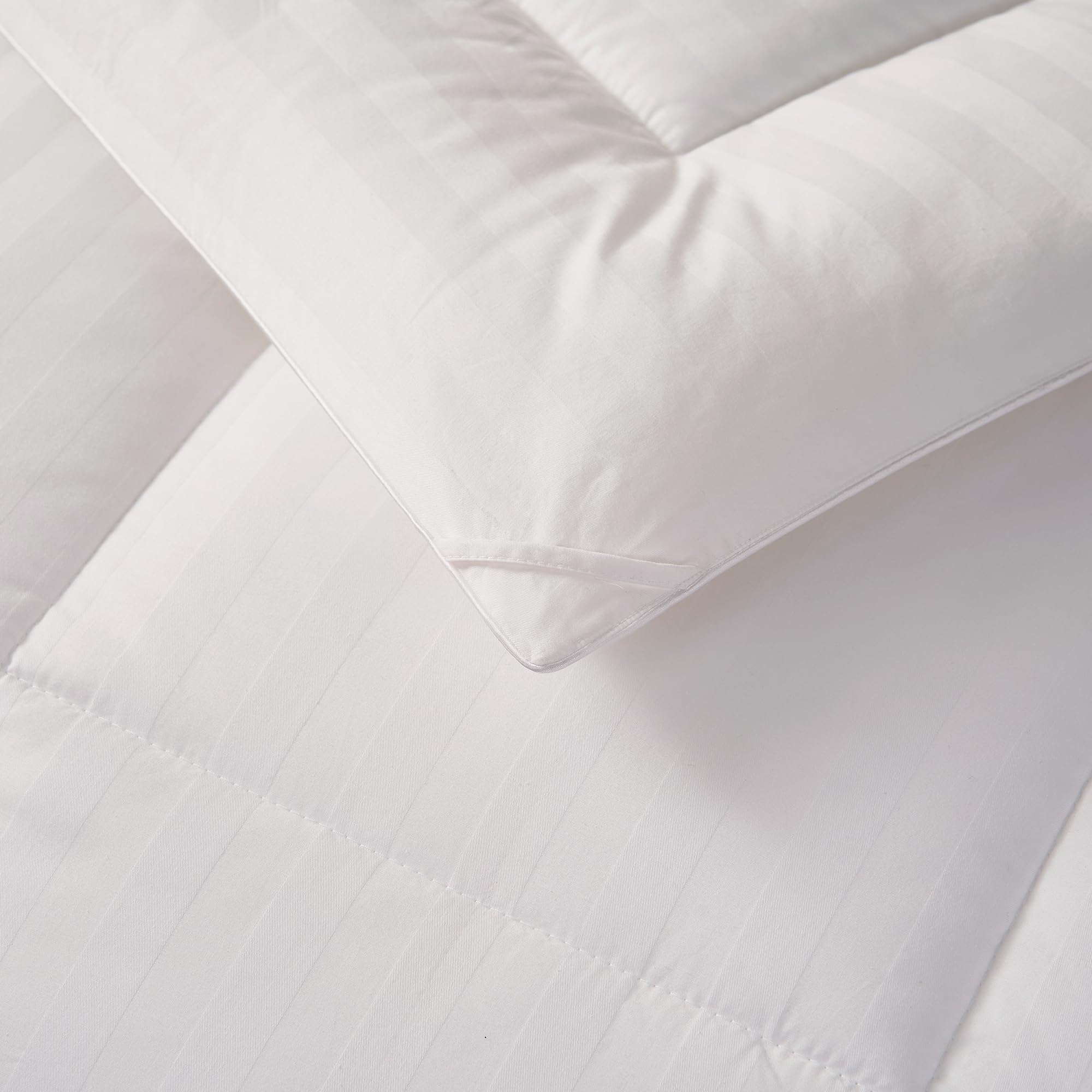 Calvin Klein comforter in styled bedroom showing designer aesthetic and cozy atmosphere benefit