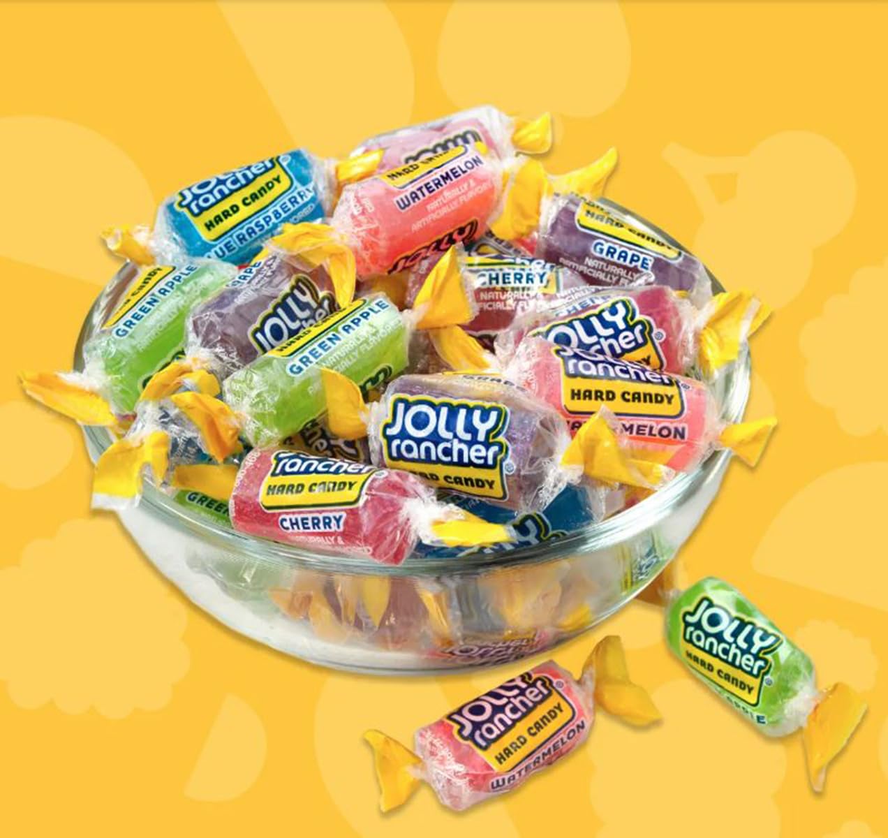 Candylish Jolly Ranchers next to a hand showing approximate candy size