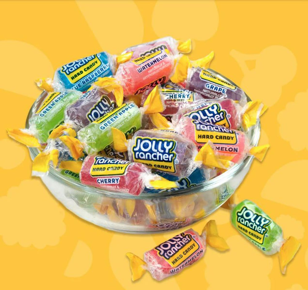 Candylish Jolly Ranchers next to a hand showing approximate candy size