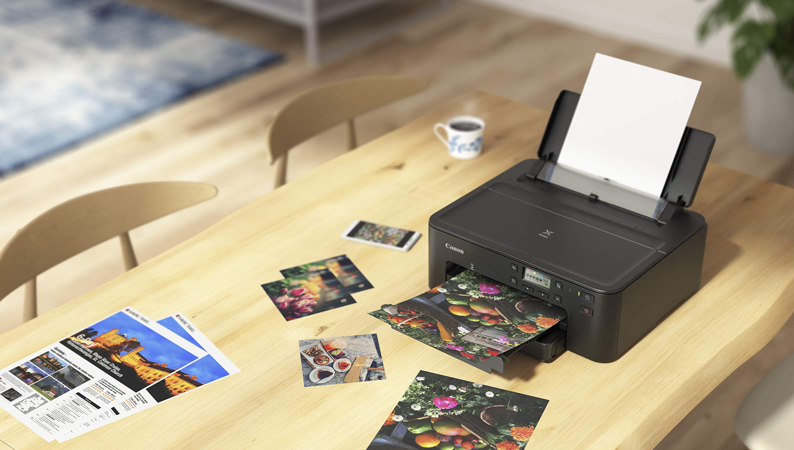 Canon PIXMA TS702a next to legal paper illustrating large-format support advantage