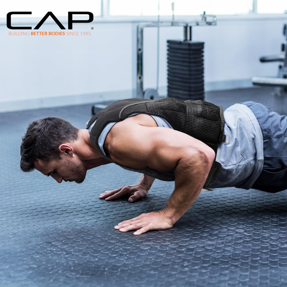Athlete wearing CAP Barbell vest while running to increase intensity and calorie burn