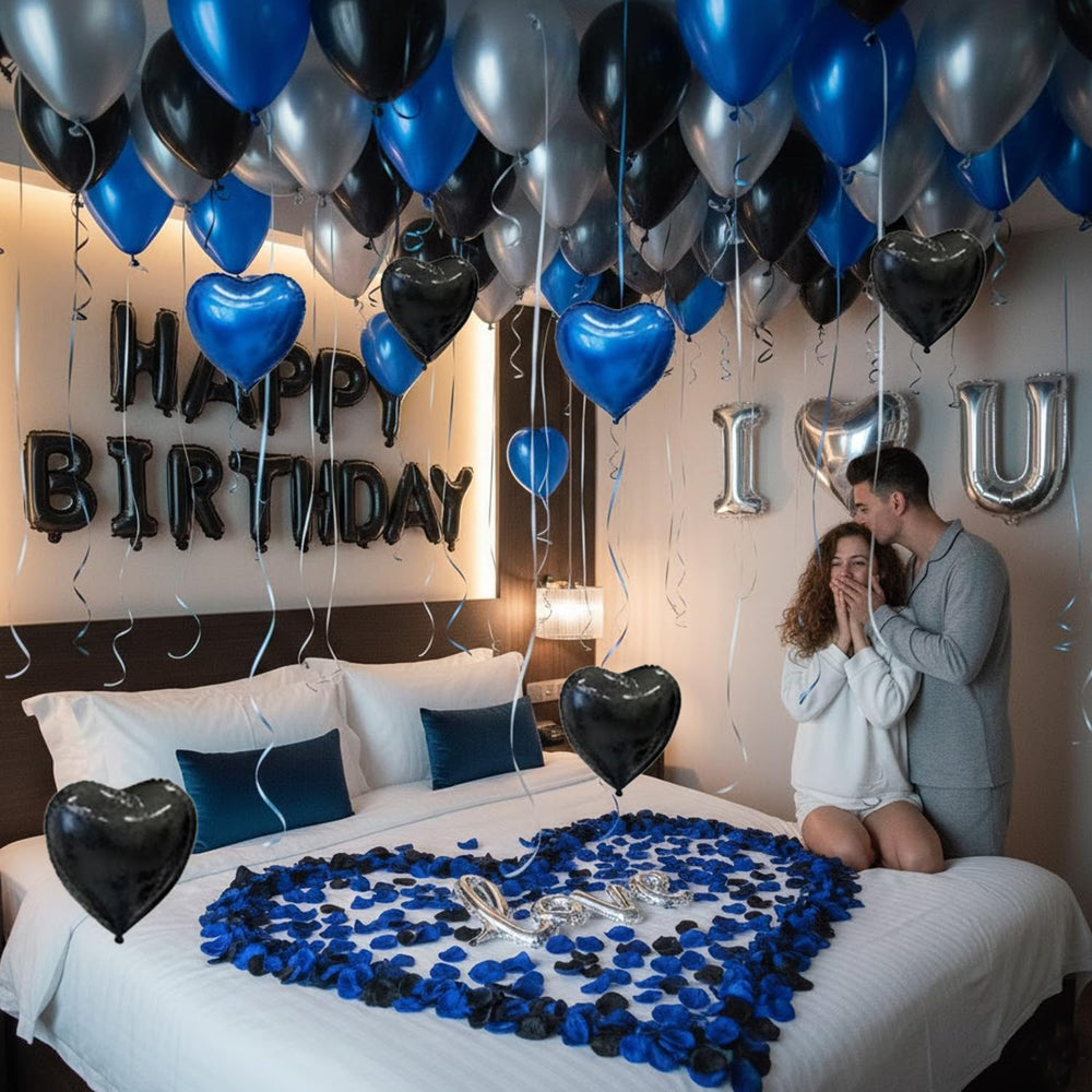 Carnira ceiling cluster of blue black silver balloons adding depth and modern celebratory mood
