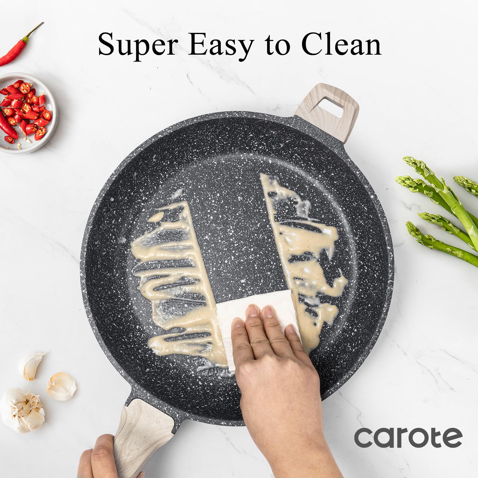 CAROTE pan next to spatula for scale showing large 12.5-inch capacity for family meals
