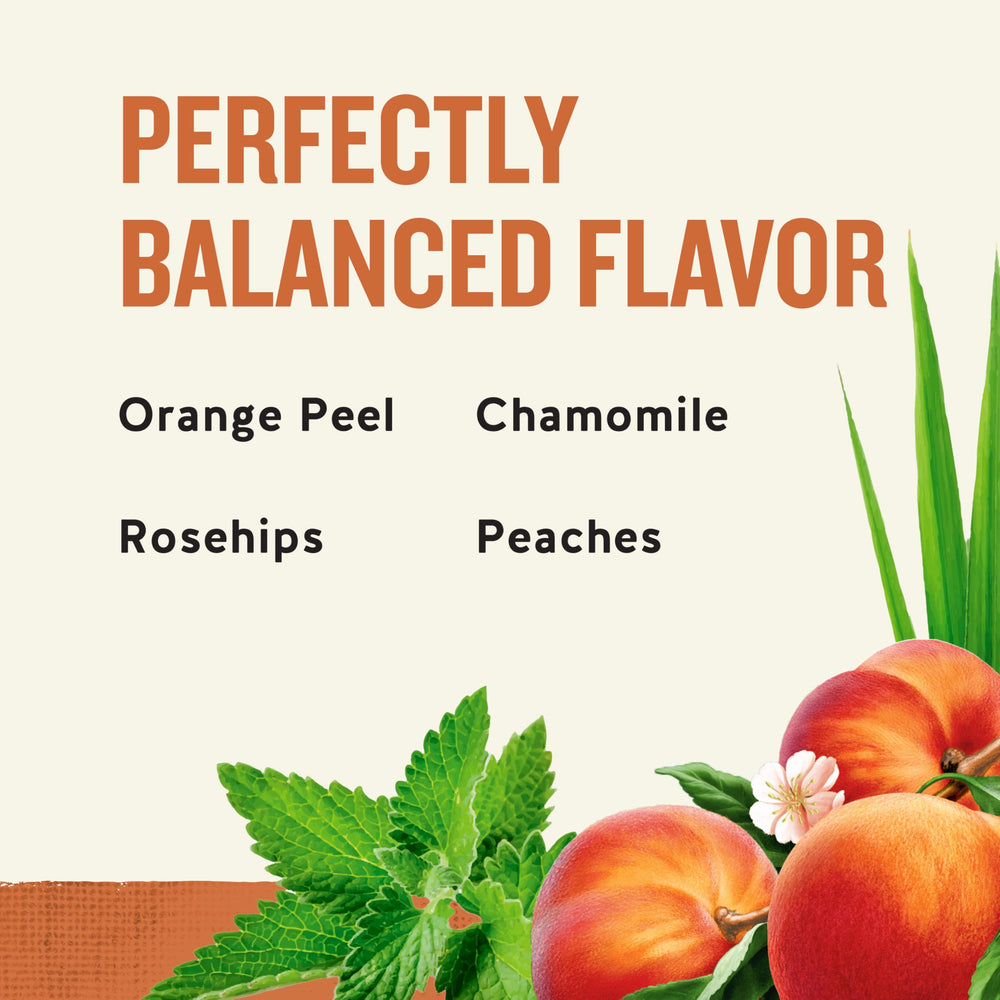 Cup steeping Celestial Seasonings tea showing rich peach color and aroma