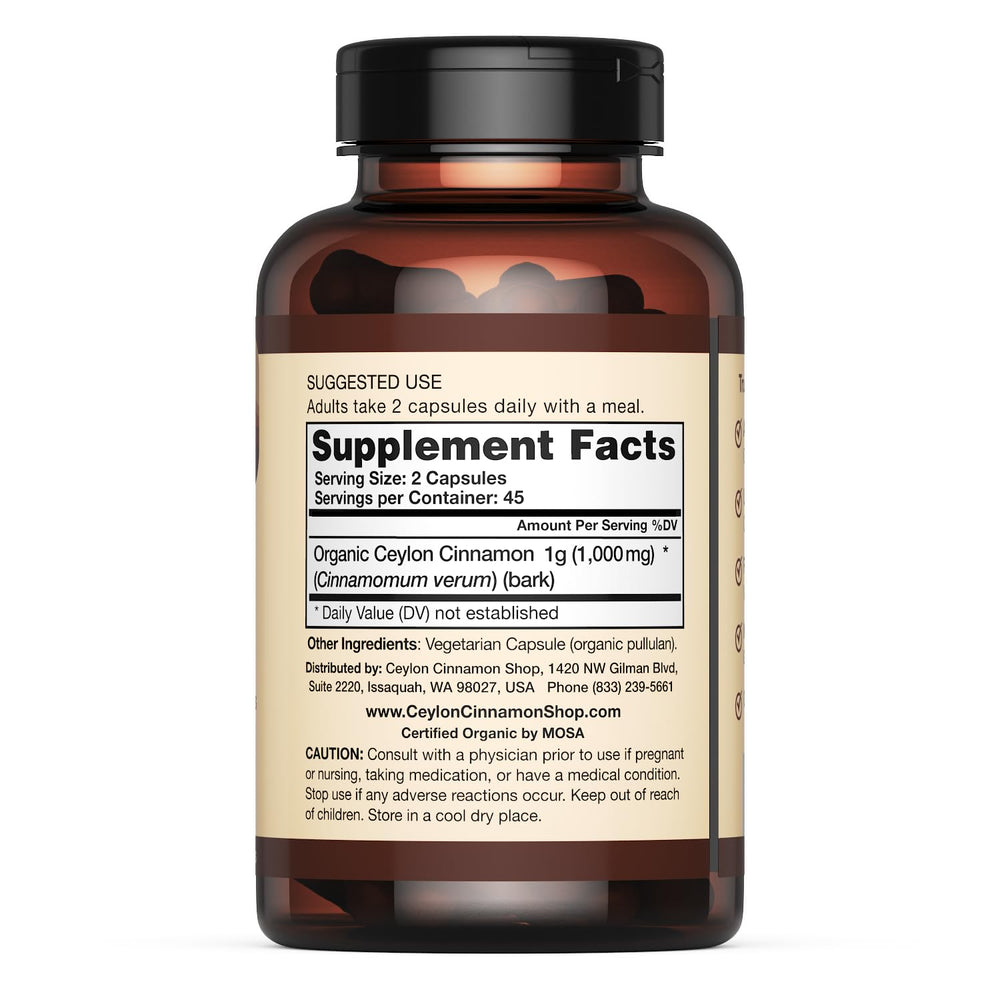 Ceylon Cinnamon Shop two capsules on palm illustrating recommended daily serving