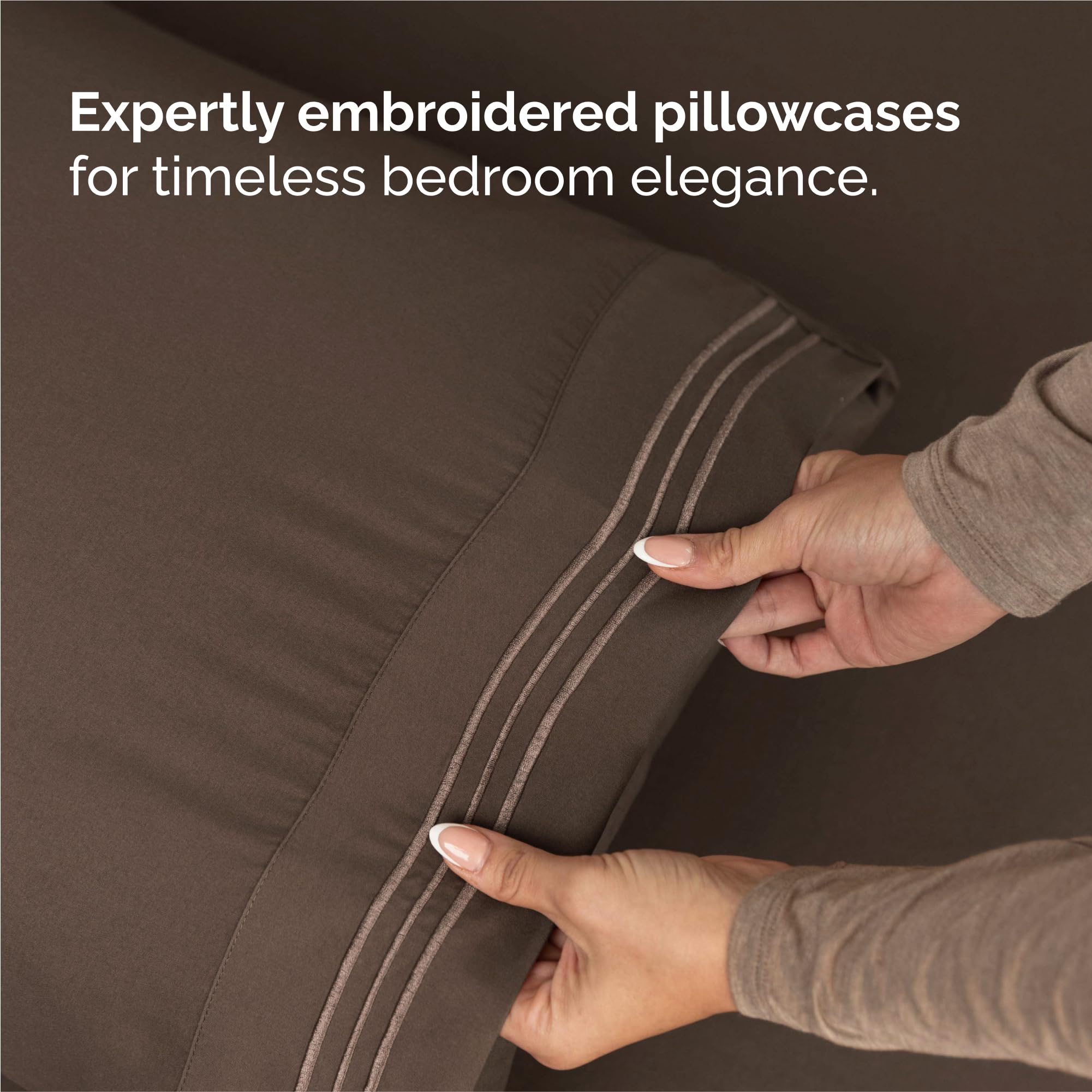 CGK Unlimited bedroom lifestyle scene with sheets on styled bed showing cozy, inviting atmosphere